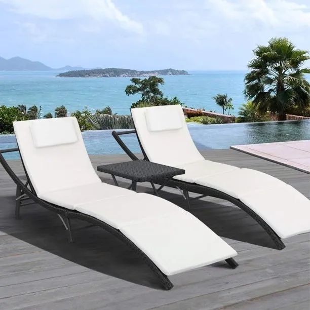 The lounge chairs and table, a stylish addition to any outdoor space for lounging or entertaining.