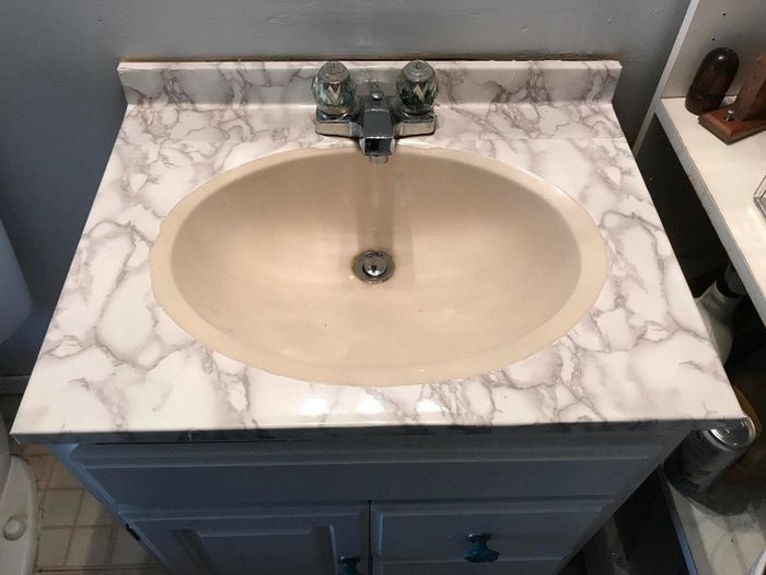Reviewer’s photo of a sink covered with contact paper.