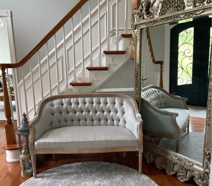 a reviewer's gray loveseat