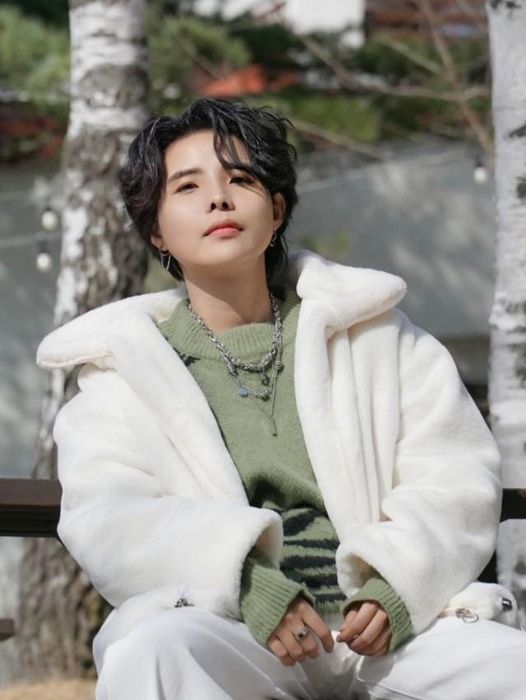 Reviewer photo showing the table in front of a stone fireplace.