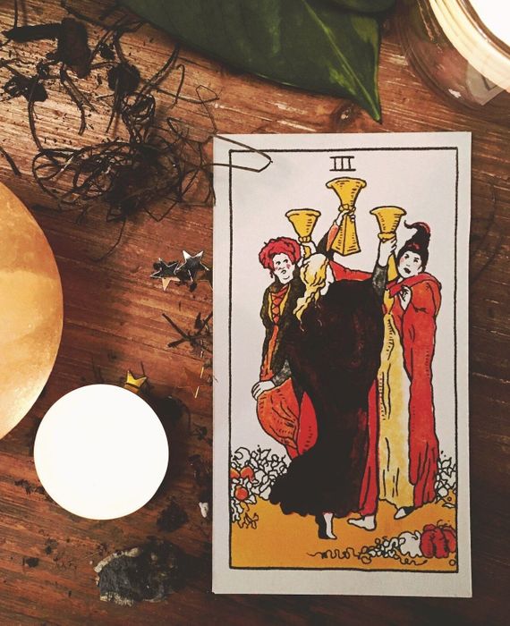 one tarot card showcasing the Sanderson sisters dancing together in a circle