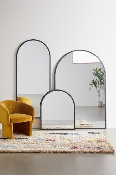 Three mirrors featuring arc-shaped frames in different sizes