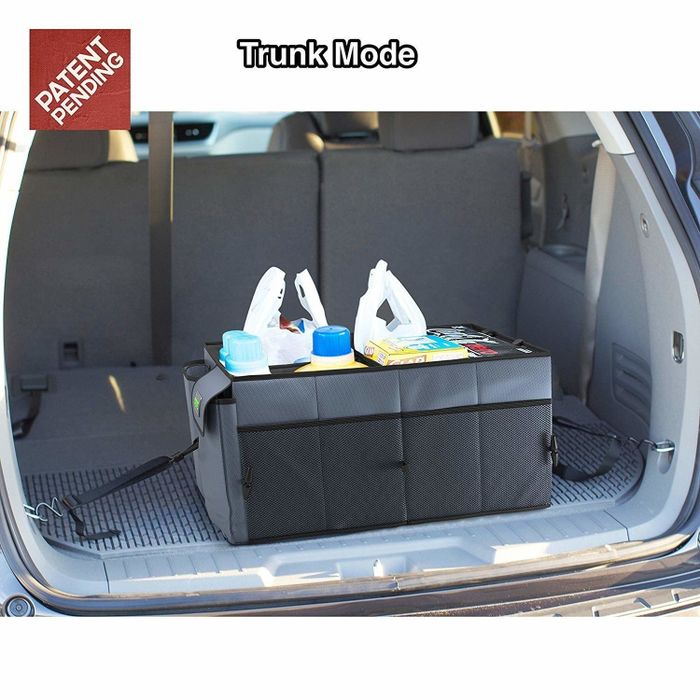 The organizer storing groceries in a car trunk