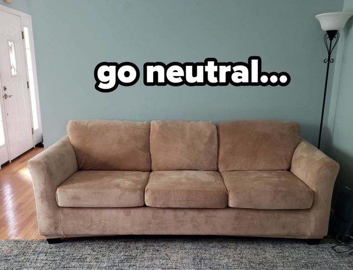 A reviewer's camel-colored stretch velvet sofa cover on a large couch with overlaid text that reads