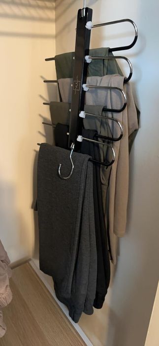 the reviewer's hanger compressed, showing how it saves significant closet space