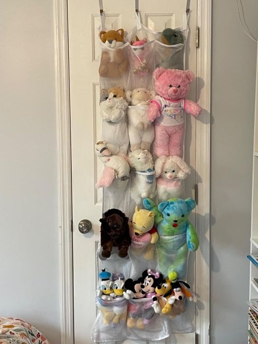 another reviewer's organizer filled with a variety of stuffed animals
