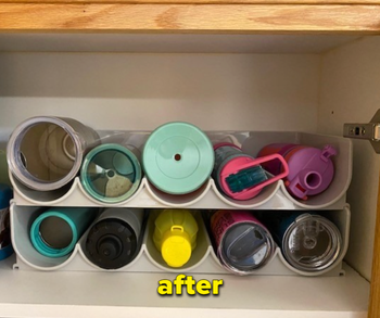 the same cabinet now neatly organized with the water bottle holder