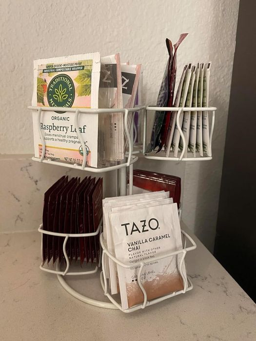 a reviewer's white tea organizer filled with various teas, neatly placed on their counter