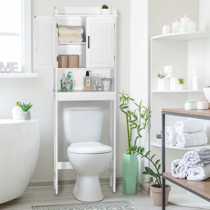 white bathroom storage cabinet positioned over the toilet