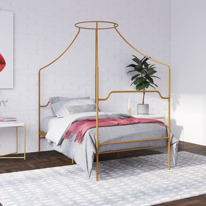 the elegant gold canopy bed