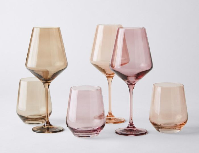 stemless and stemmed wine glasses in warm sunset tones
