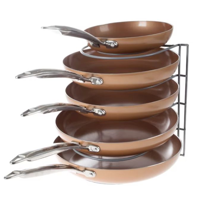 pans neatly arranged on a metal organizer