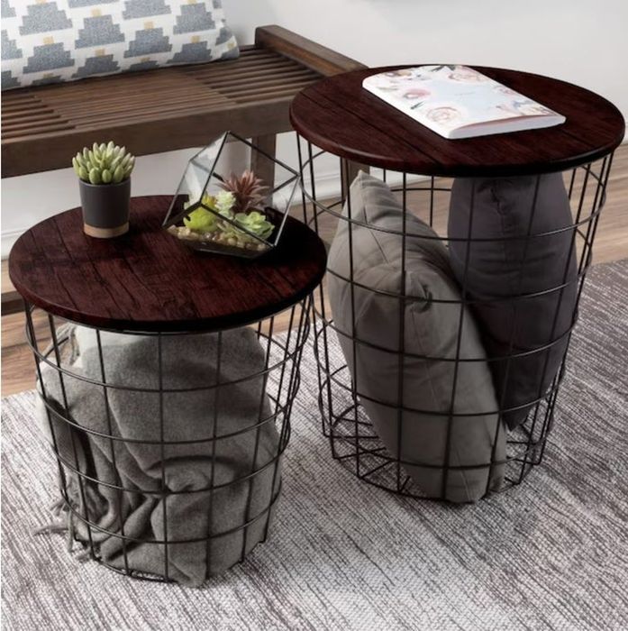nesting end tables with blankets and pillows neatly stored inside