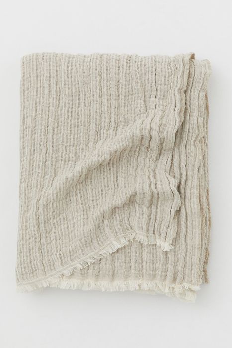 the beige linen-blend throw