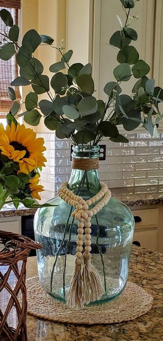 the garland gracefully wrapped around another reviewer’s vase
