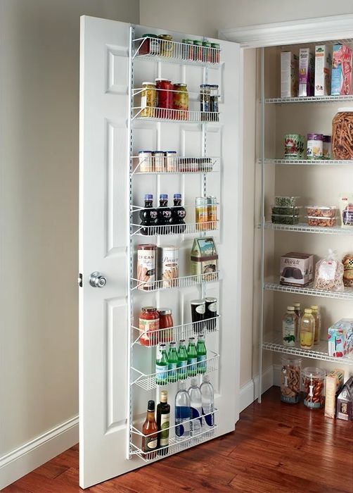 white metal pantry door organizer filled with various food items