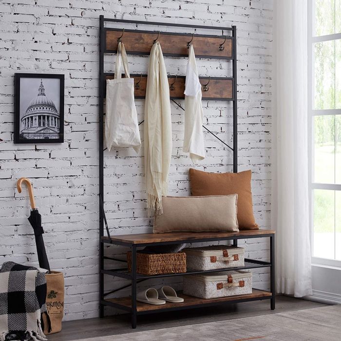 the bench and organizer featuring pillows and storage cubbies