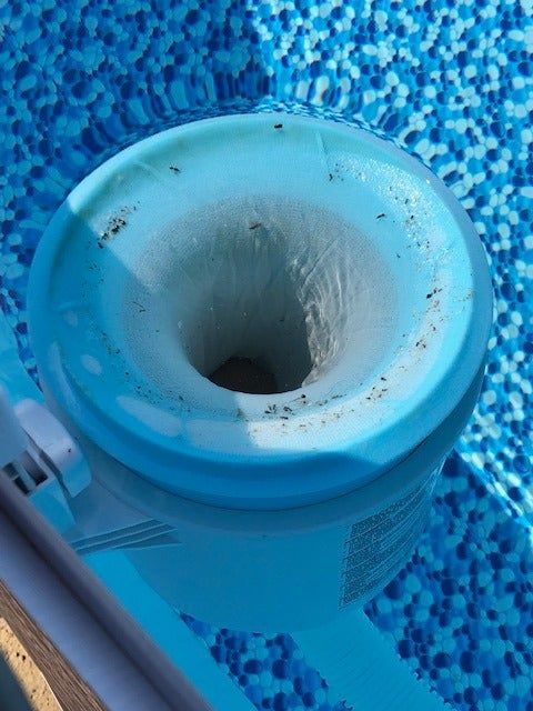 A reviewer's photo of the sock on an above-ground skimmer basket