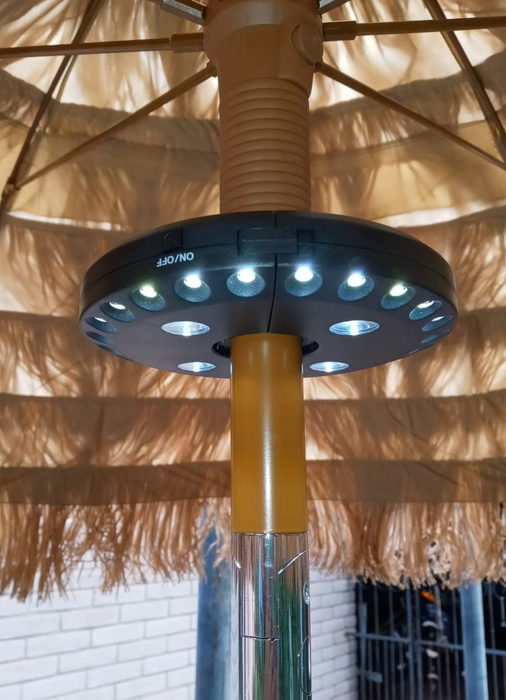 A reviewer’s photo depicting the light installed on a table umbrella pole
