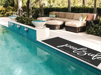 A personalized runner placed by the poolside, adding charm to your outdoor space.