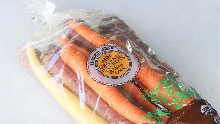 A bag of fresh, vibrant carrots