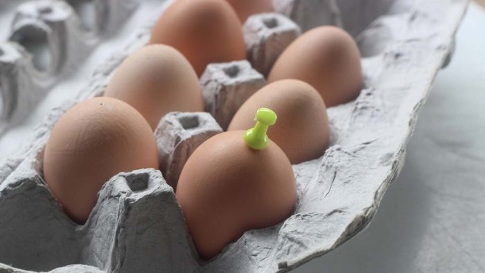 Poking a hole in your eggs before boiling them ensures that peeling becomes much simpler.