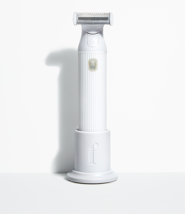 White trimmer placed in a tabletop holder