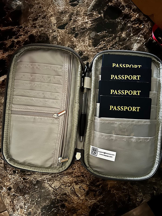 A close-up shot of the inside of the document holder, displaying several passports neatly arranged.