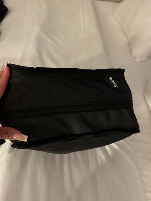A reviewer image of a packing cube filled with clothes.