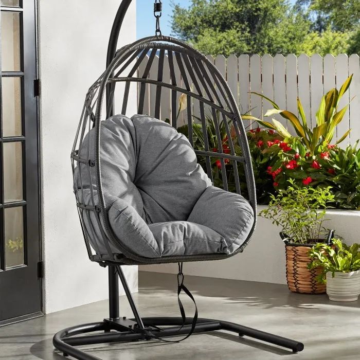 The chair comes in sleek black with a cozy gray cushion.