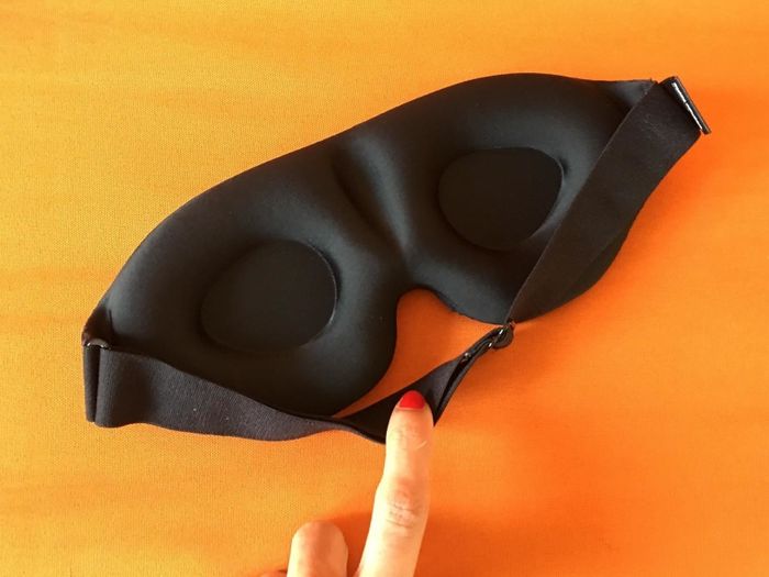 A close-up view of the underside of the sleep mask, highlighting its contoured shape.