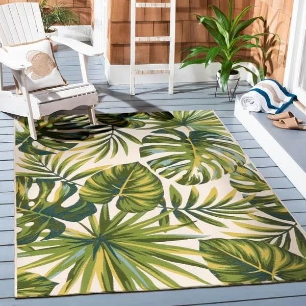 The outdoor rug with palm tree leaves.