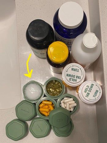 The green Cadence Capsules, filled with various lotions and pills.