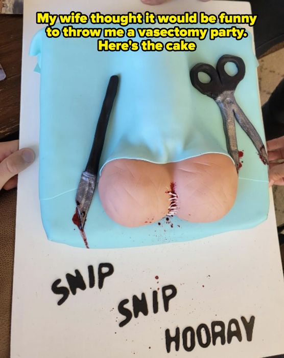 A cake shaped like buttocks, covered in fondant and decorated with a pair of scissors and a knife. The text reads 'Snip Snip Hooray.'