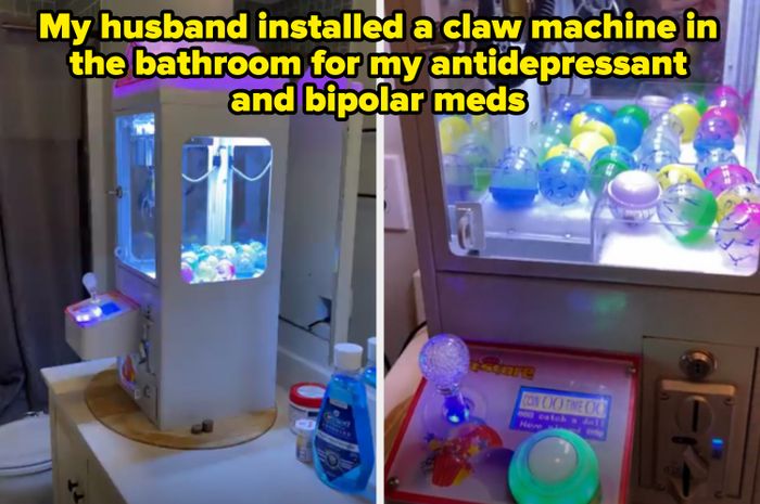 A small claw machine sitting on a bathroom counter filled with colorful toy capsules