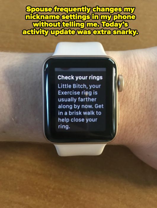 A smartwatch shows a motivational reminder to boost physical activity and close the exercise ring