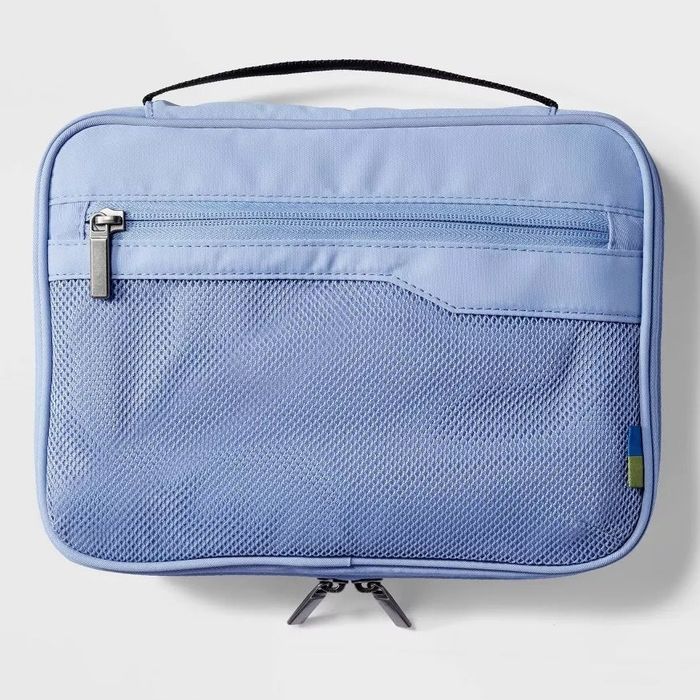 Soft travel organizer with a zipper and mesh pocket for easy storage