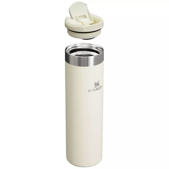 A stainless steel travel mug with an open lid, showing off its streamlined design, perfect for drinks on the go