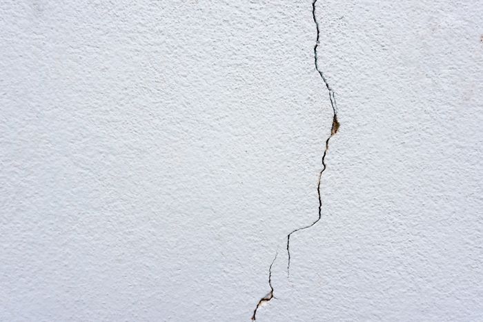 A wall with noticeable cracks.