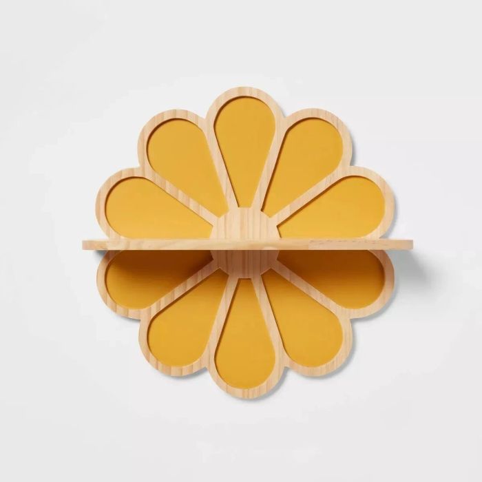A wooden wall shelf featuring a cute flower design, perfect for adding a pop of color to any space.