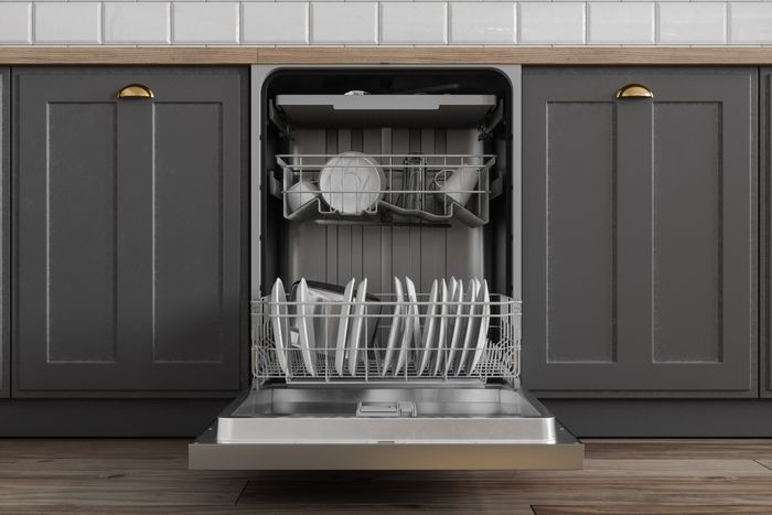 Dishwasher with clean dishes inside, tucked neatly under the kitchen counter