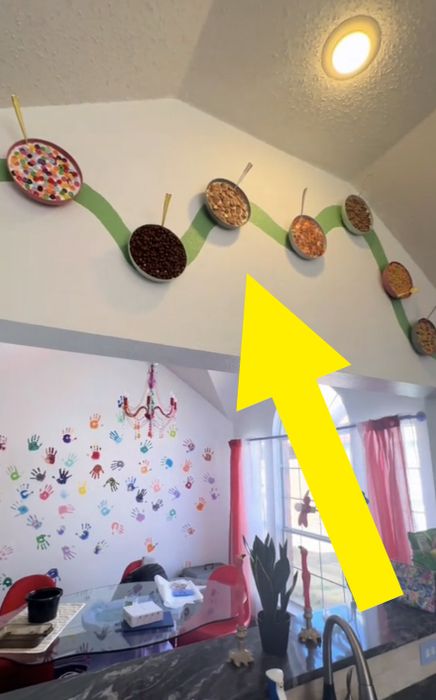 A closer view of the cereal wall, featuring fake bowls of cereal arranged in a wavy pattern on the wall as an art installation