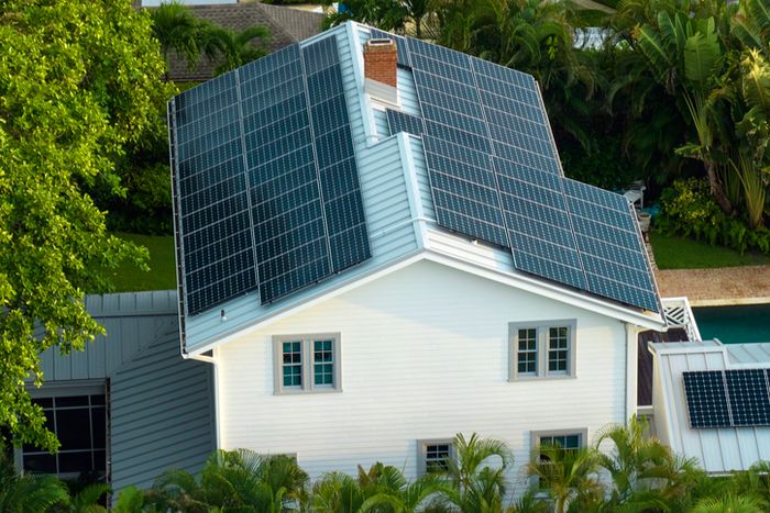 A house featuring solar panels on the roof, showcasing sustainable energy for a Nifty lifestyle article