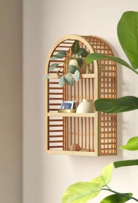 Arched wooden wall shelf with three open shelves and woven edges