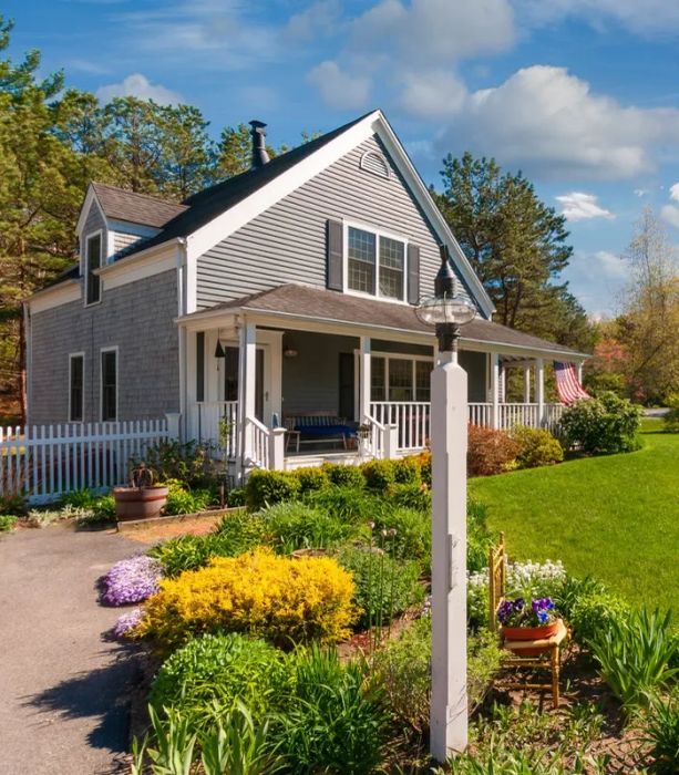 A house exterior with a front yard and a porch