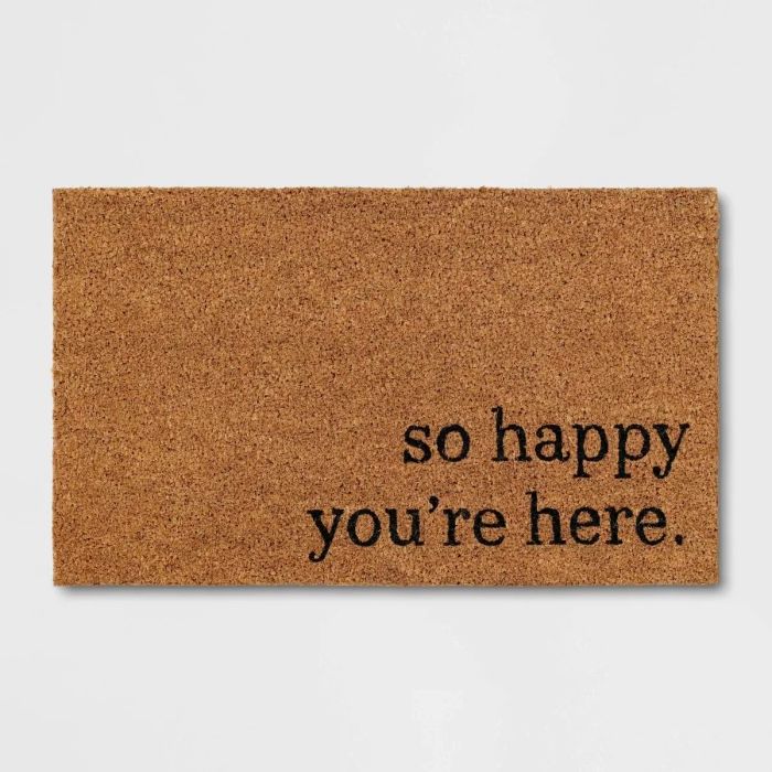 Brown doormat with the words