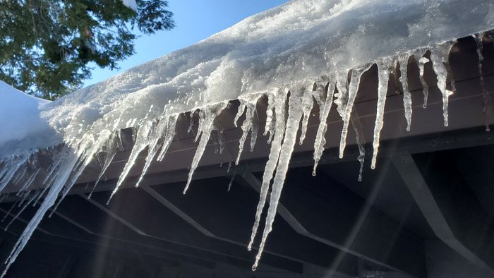 Icicles hanging from a house's roof