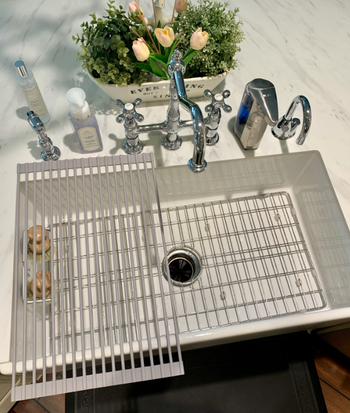 A photo of the drying rack placed over one half of the sink by the reviewer