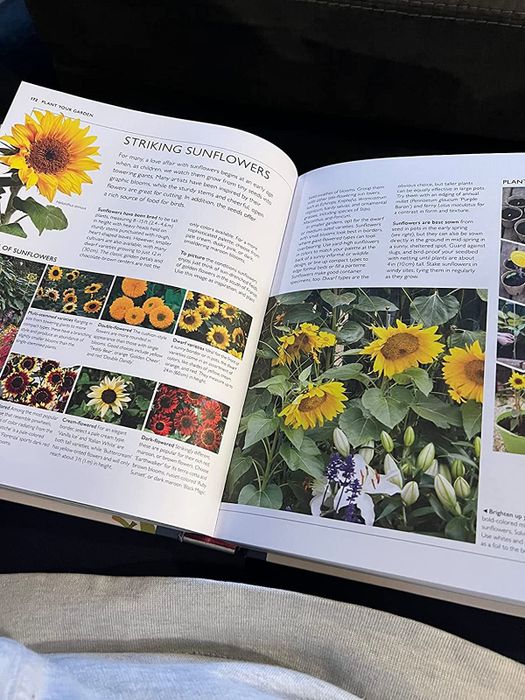 A page from the book opened on a reviewer's lap, diving into the details of gardening