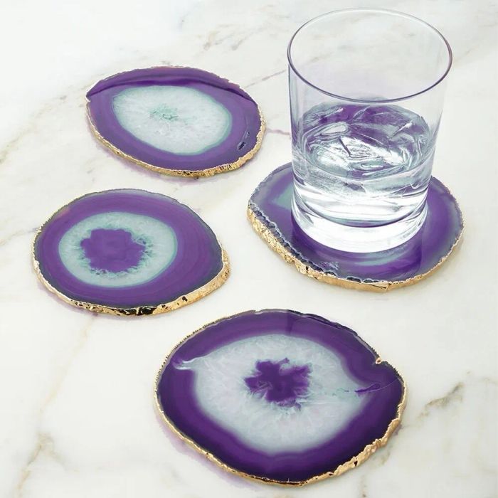 A stunning set of agate coasters with gold-trimmed edges, radiating elegance and sophistication.